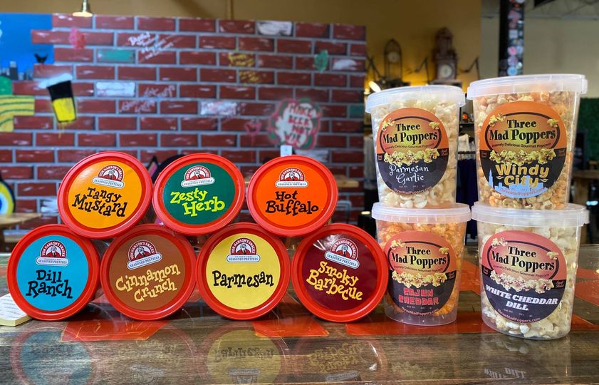 Snacks all around! We have Von Hanson’s Seasoned Pretzels & Three Mad Poppers Go